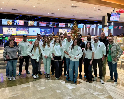 The Shoemaker Snoddy Roofing & Construction team and their families at the company holiday party